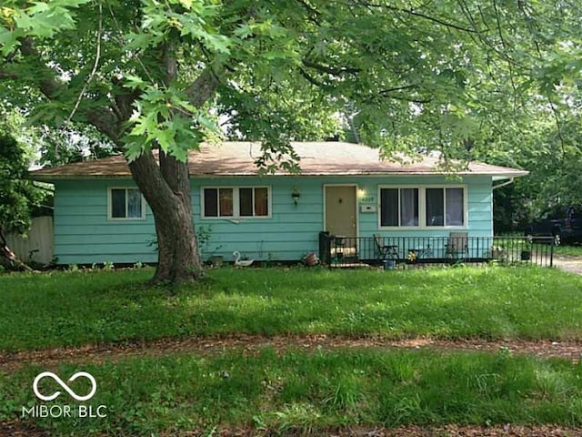 ranch-style house with a front lawn