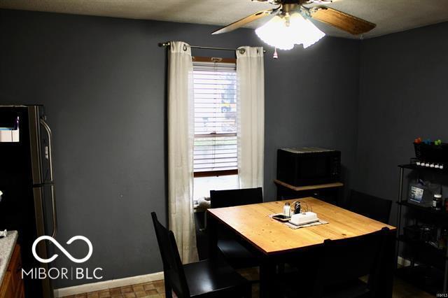 dining space featuring ceiling fan