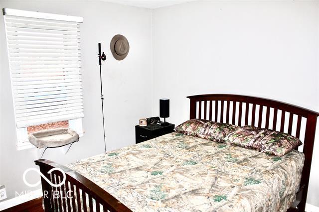 bedroom featuring dark wood-type flooring