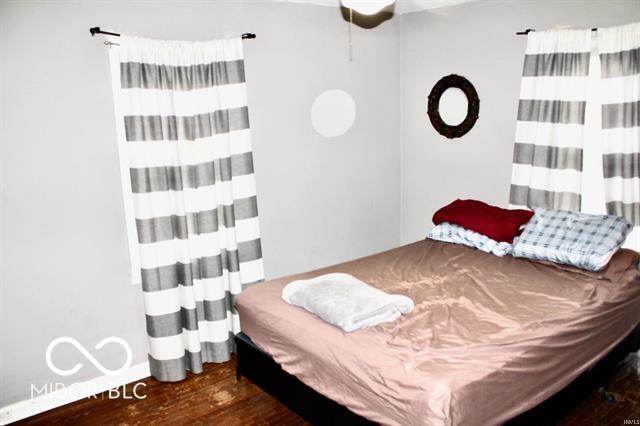 bedroom featuring dark wood-type flooring