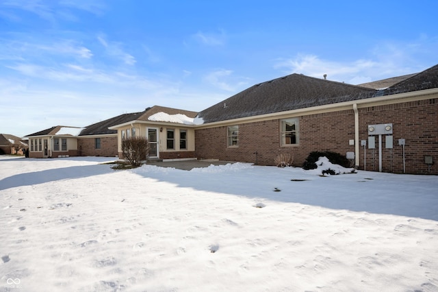 view of snow covered house