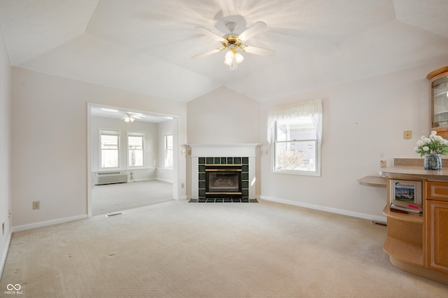 unfurnished living room featuring ceiling fan, light carpet, and a healthy amount of sunlight