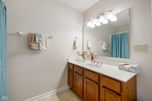 bathroom featuring tile patterned floors, vanity, and a shower with shower curtain