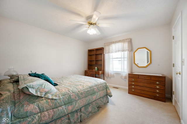 bedroom with ceiling fan and carpet floors