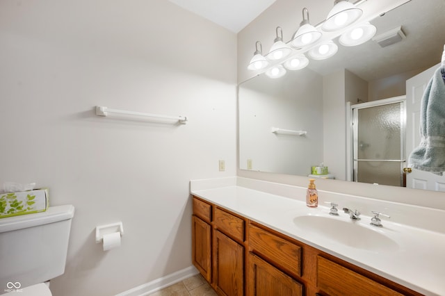 bathroom with a shower with shower door, tile patterned floors, toilet, and vanity