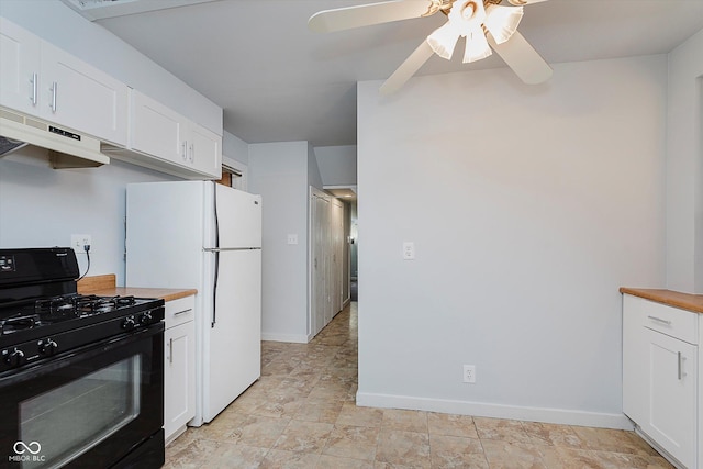 kitchen featuring white cabinets, wooden counters, white fridge, and black range with gas stovetop