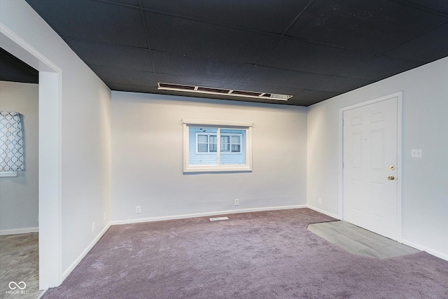 carpeted empty room featuring visible vents and baseboards