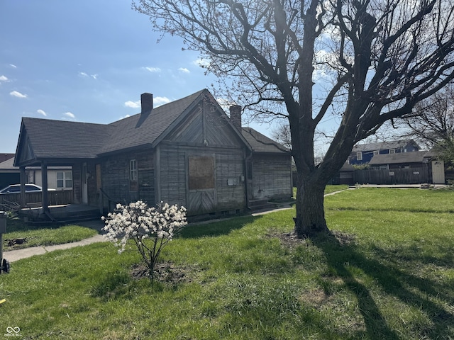 view of property exterior with a yard