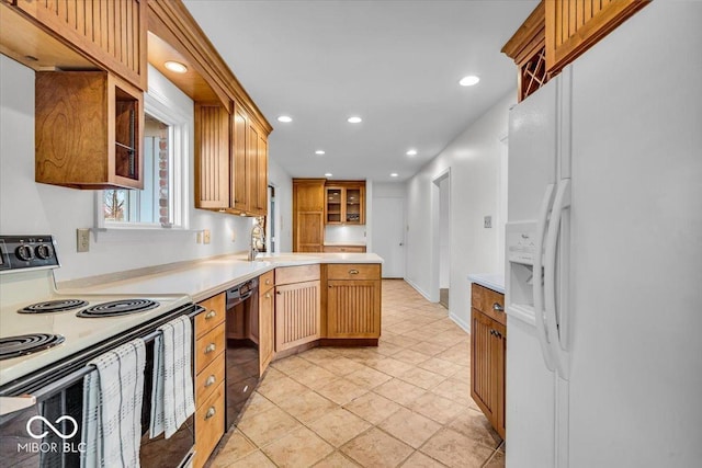 kitchen with range with electric cooktop, dishwasher, light countertops, recessed lighting, and white refrigerator with ice dispenser