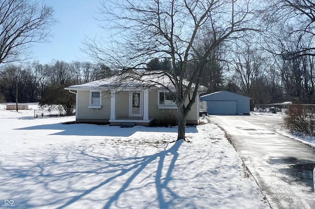 view of front of home featuring a garage and an outdoor structure