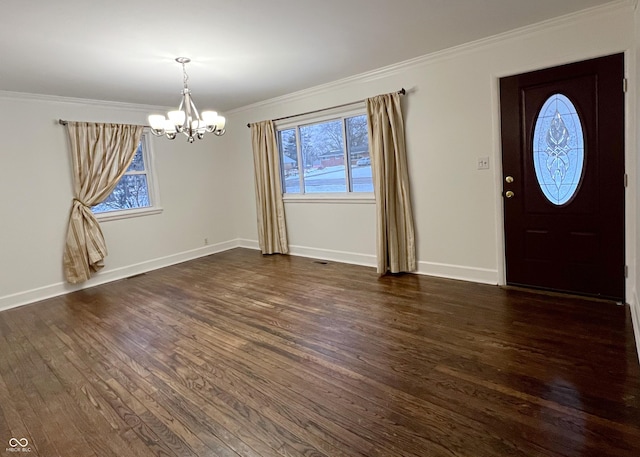 entryway with baseboards, plenty of natural light, dark wood finished floors, and crown molding