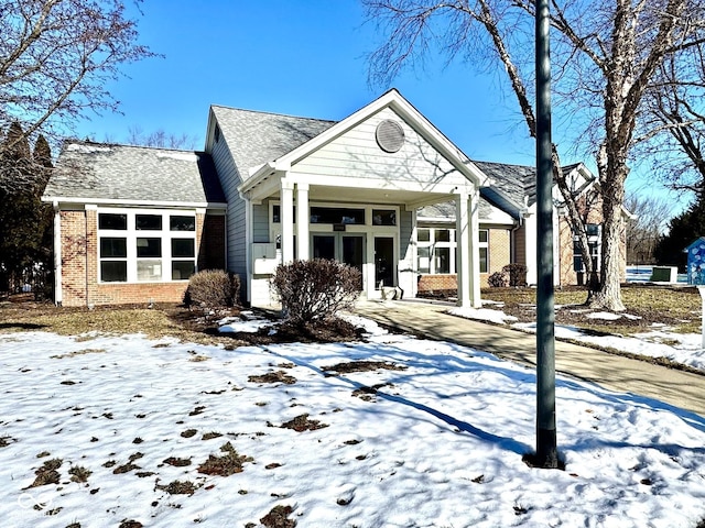 view of front of home with brick siding