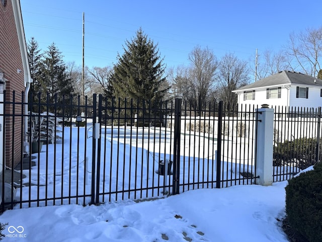 view of snow covered gate