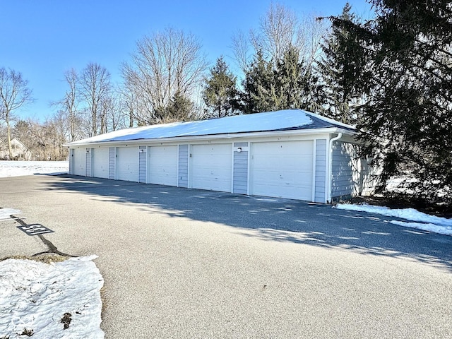 view of snow covered garage