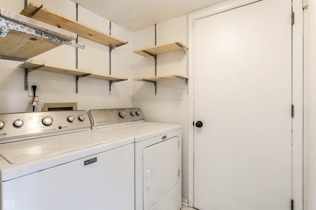 laundry room with separate washer and dryer