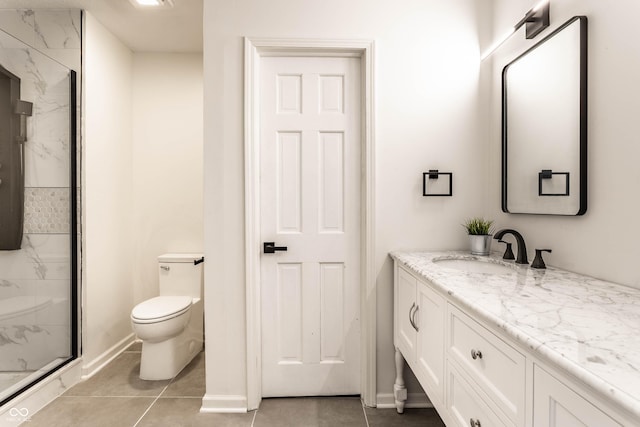 bathroom with vanity, toilet, a shower with shower door, and tile patterned flooring