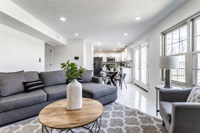 living room with a textured ceiling