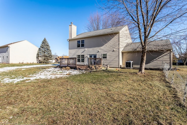 back of house featuring a yard, a deck, and central air condition unit