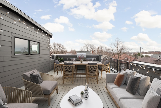 wooden terrace featuring an outdoor hangout area