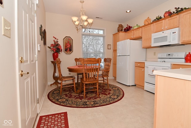 kitchen with hanging light fixtures, a chandelier, light brown cabinetry, and white appliances