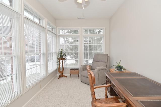 sunroom / solarium featuring ceiling fan