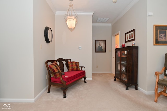 sitting room featuring crown molding and light colored carpet