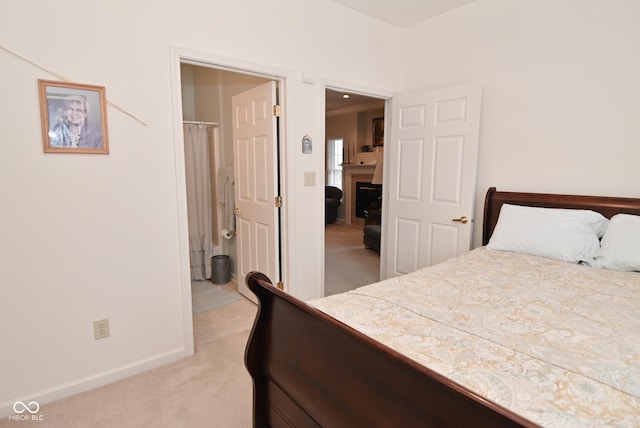 carpeted bedroom with ensuite bath