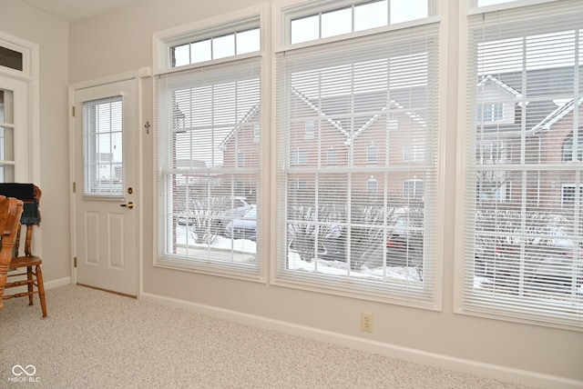 entryway with carpet flooring