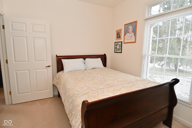 bedroom with light carpet