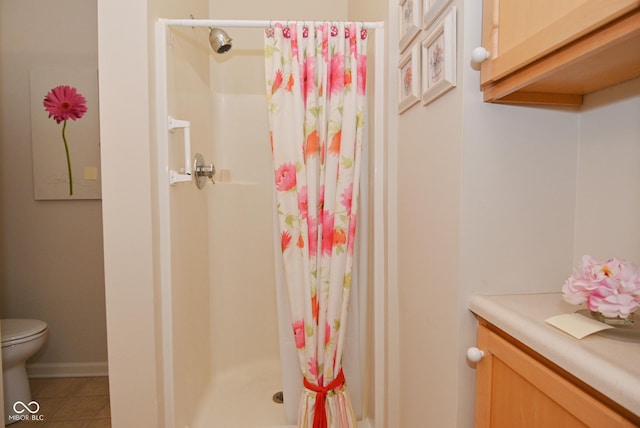 bathroom with tile patterned flooring, curtained shower, and toilet