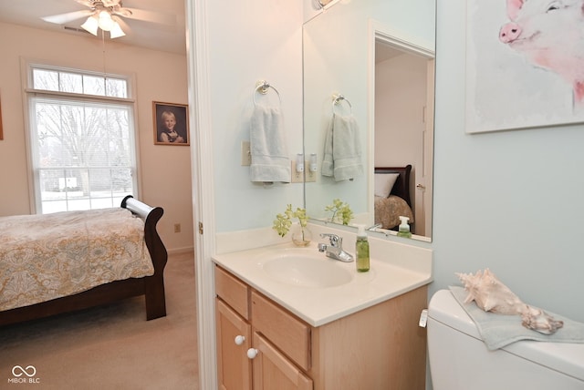 bathroom with vanity, ceiling fan, and toilet