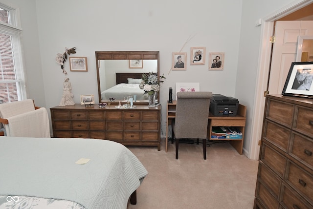 bedroom featuring light colored carpet