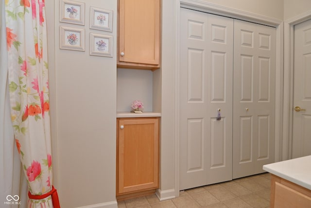 bathroom featuring tile patterned floors and vanity