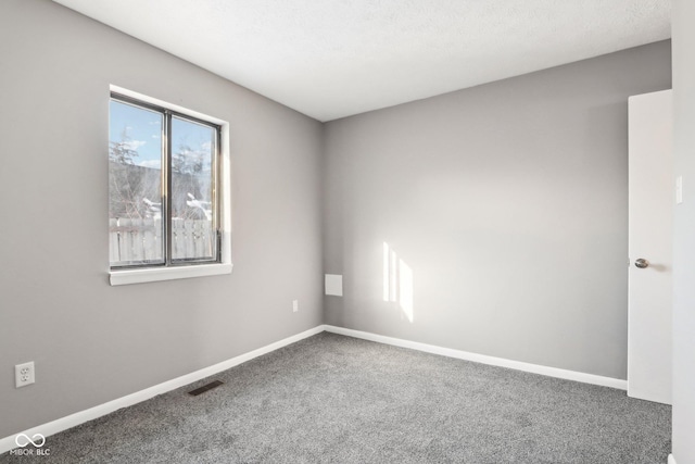 empty room featuring carpet flooring