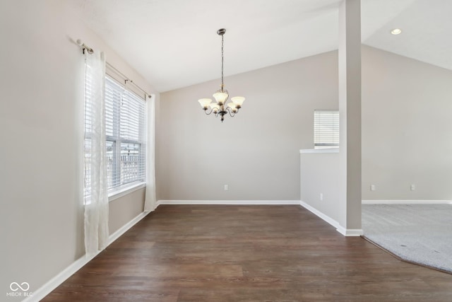 unfurnished dining area with a chandelier, lofted ceiling, and dark hardwood / wood-style flooring