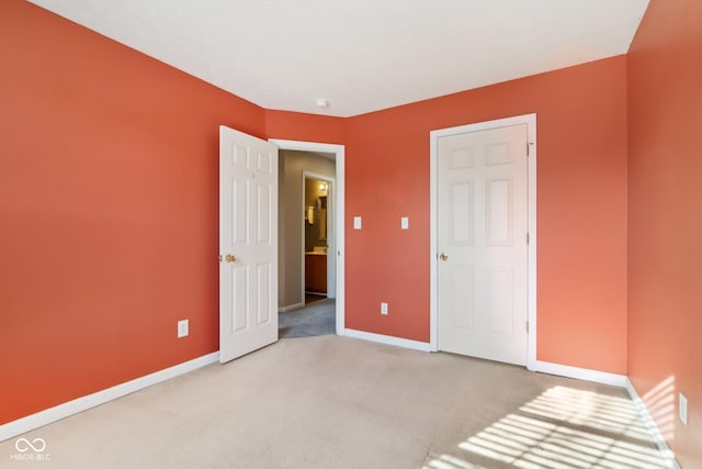 unfurnished bedroom featuring carpet