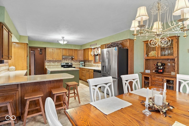 dining space featuring a chandelier