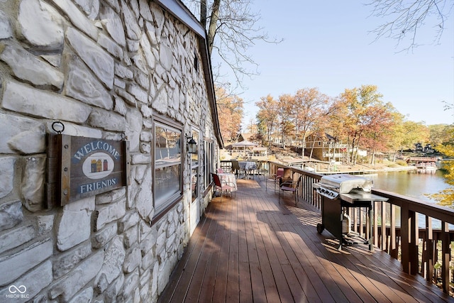 wooden deck with a water view