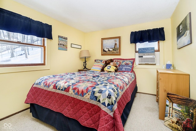 carpeted bedroom with baseboards and cooling unit