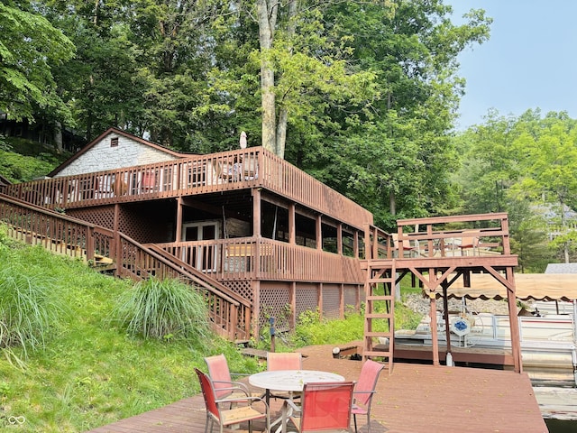 7018 Drum Dr, Nineveh, IN 46164 - wooden deck with stairway and outdoor dining area