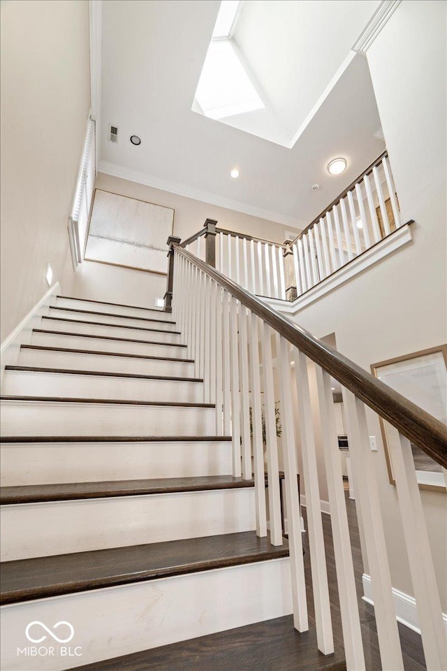 stairs with recessed lighting, visible vents, and wood finished floors