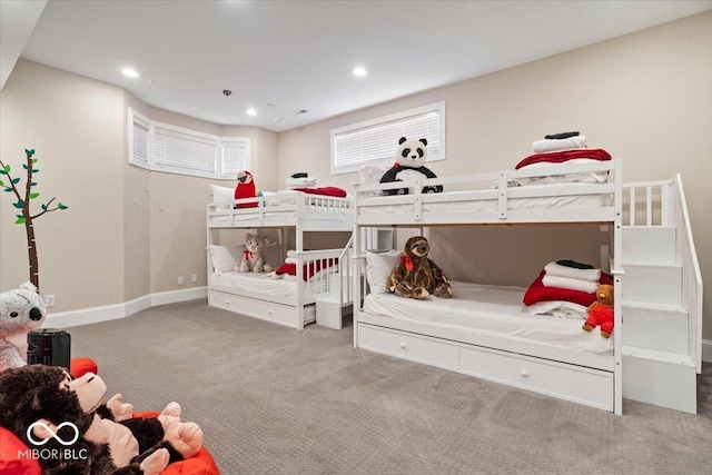 carpeted bedroom featuring recessed lighting and baseboards