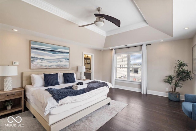 bedroom featuring baseboards, recessed lighting, ornamental molding, wood-type flooring, and a raised ceiling