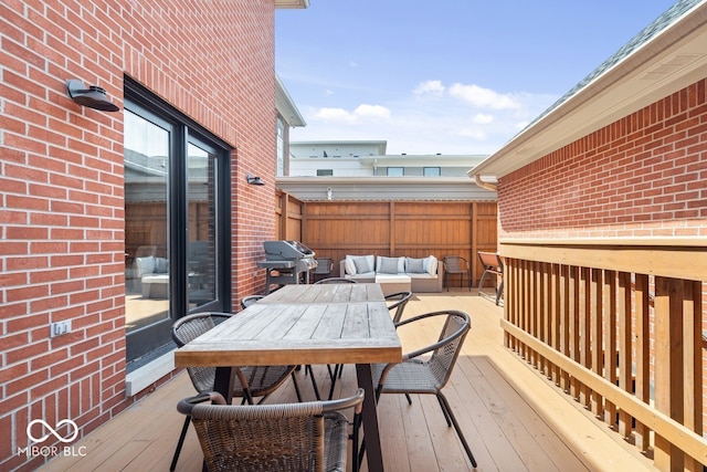 wooden terrace featuring outdoor dining space, an outdoor living space, fence, and grilling area