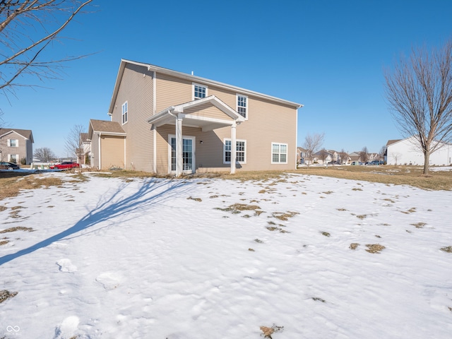 view of snow covered house