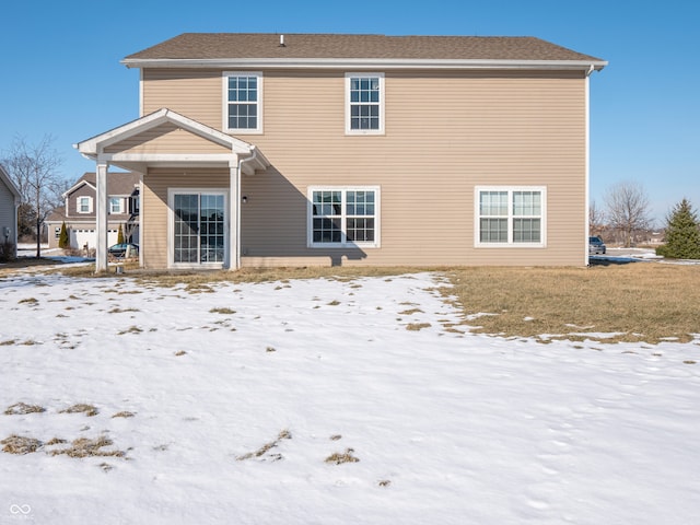 view of snow covered property