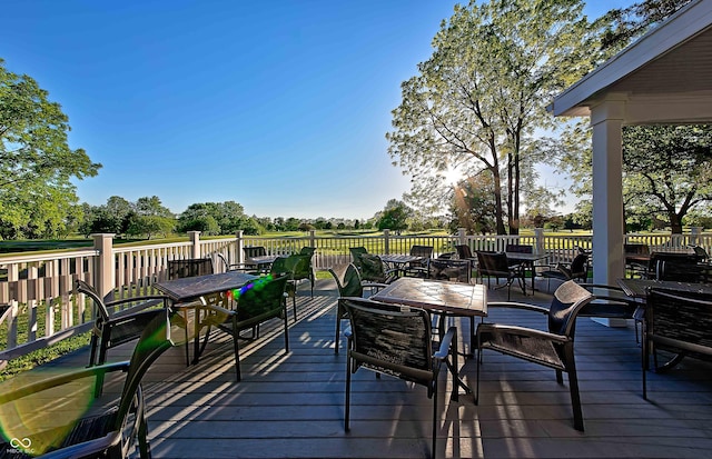 wooden deck with outdoor dining area