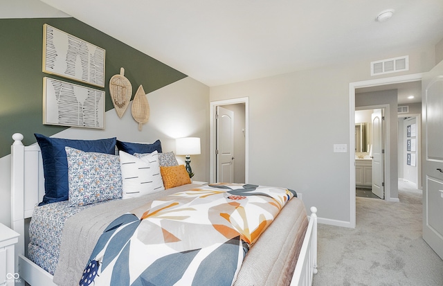 bedroom featuring light carpet, baseboards, and visible vents