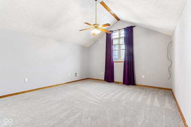 bonus room with a textured ceiling, a ceiling fan, baseboards, vaulted ceiling, and carpet