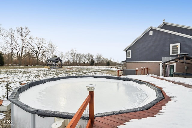 yard covered in snow featuring central AC and a deck